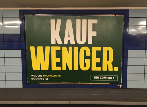 "Kauf Weniger" Plakat